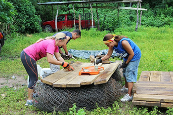 Image of students working with wooden planks - ewb13-6