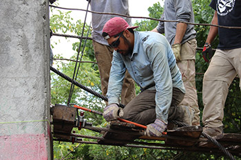 Image of students fixing a bridge - ewb13-8