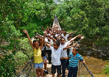 Image of kids standing on a bridge - ewb13-11
